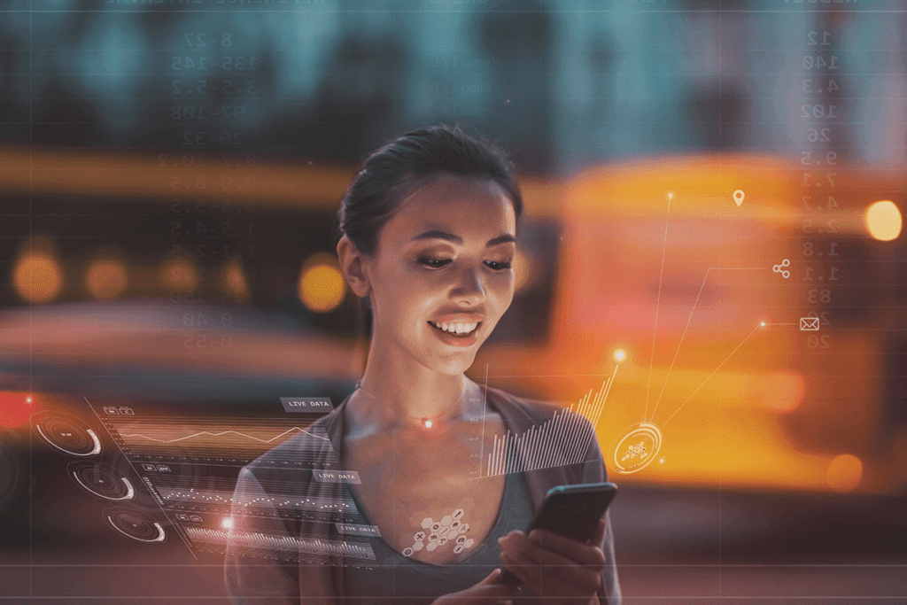 A young woman smiles while looking at her phone, while her data is visualized
