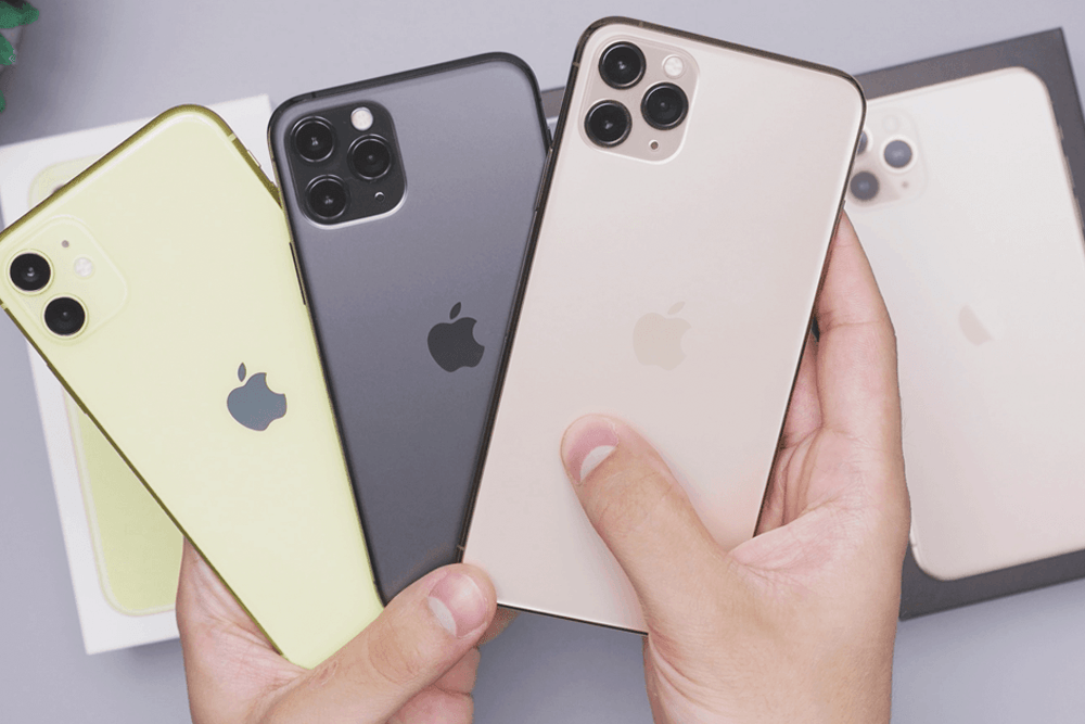 A man holds three iPhones