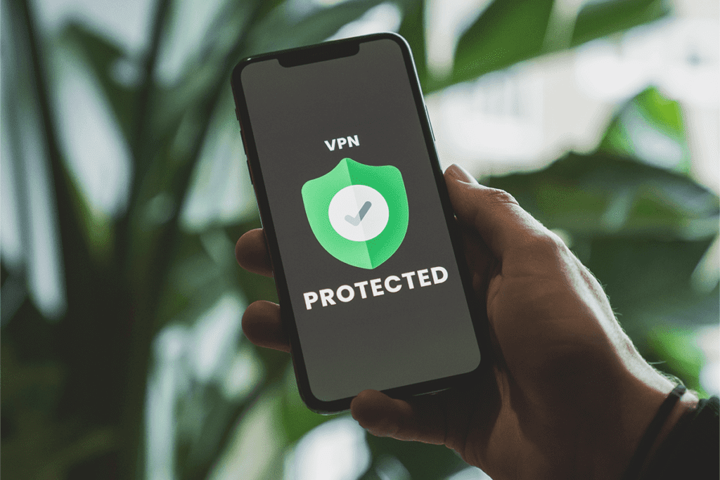 Choose the best VPN. A person chooses a phone that displays the words "VPN Protected" around a green shield with a checkmark to denote the best