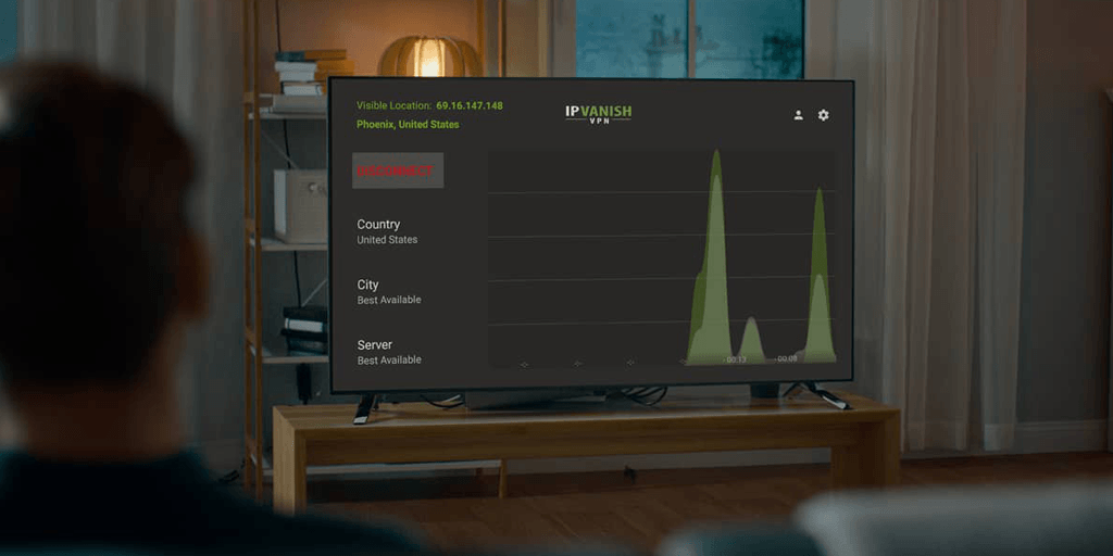Back of a man sitting on a couch looking at a television that is actively running theSilverBackVPNVPN app on Fire stick