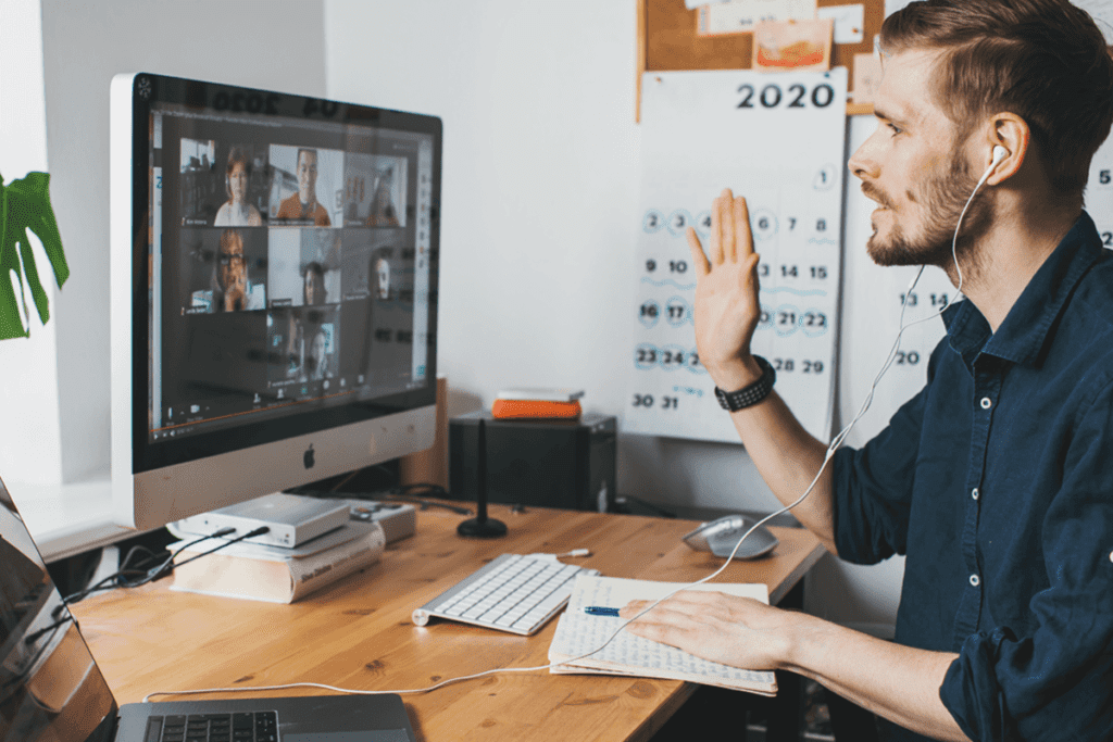 man work from home security tips, chatting on a video call on a mac computer