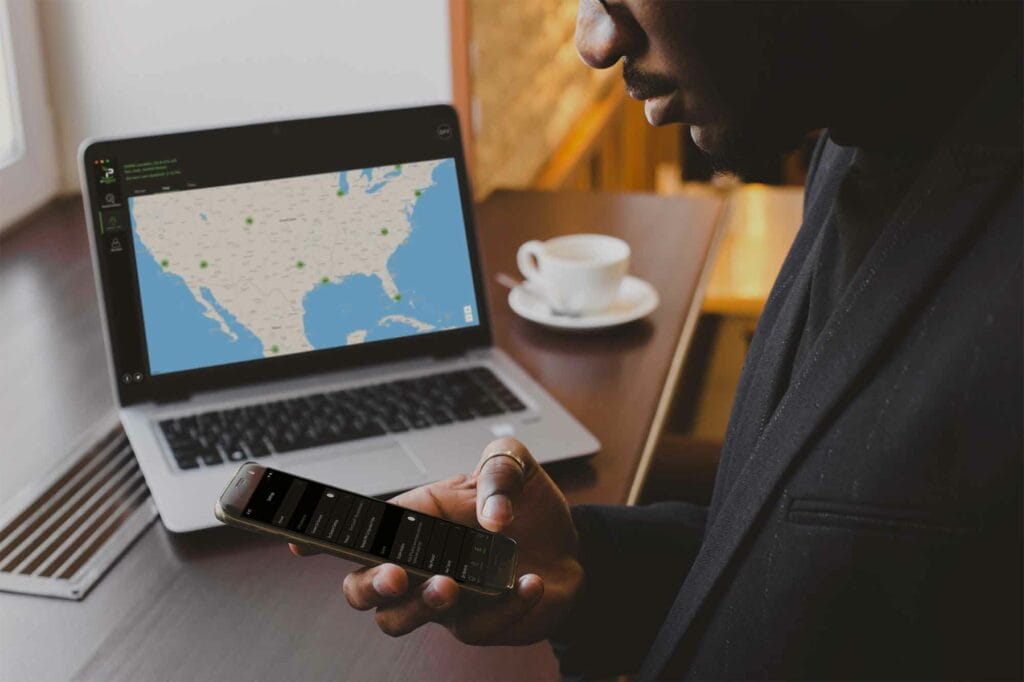 A person using silverbackvpn app on mobile and laptop devices