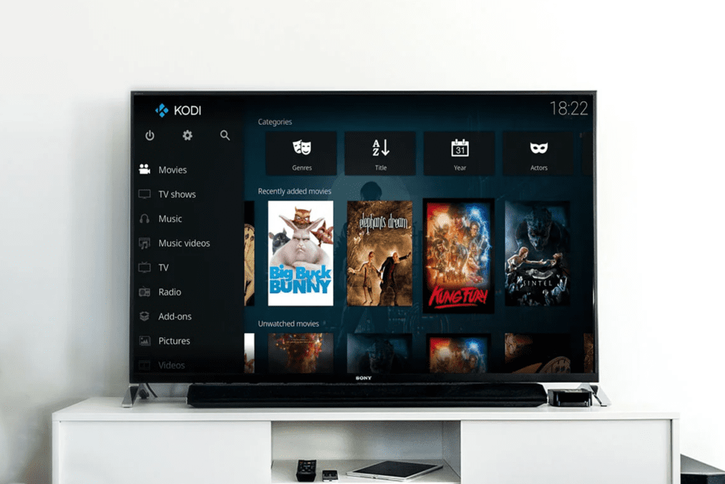 A smart television displays the user-interface of the Kodi Media Center to visualize how to install Kodi on fire stick