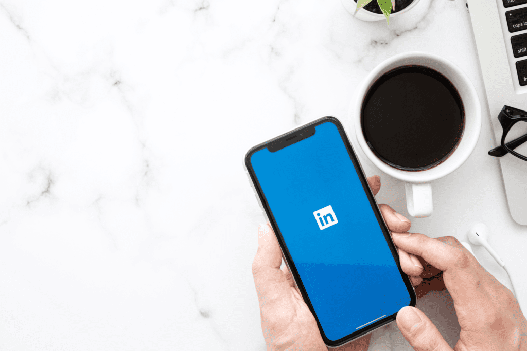 Person logging into LinkedIn account on mobile device