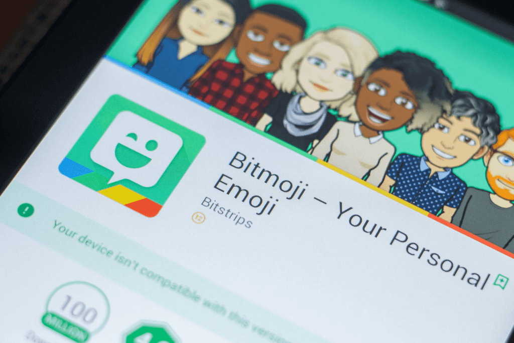 A cellphone displays the App Store listing of Bitmoji app to help determine is Bitmoji safe?