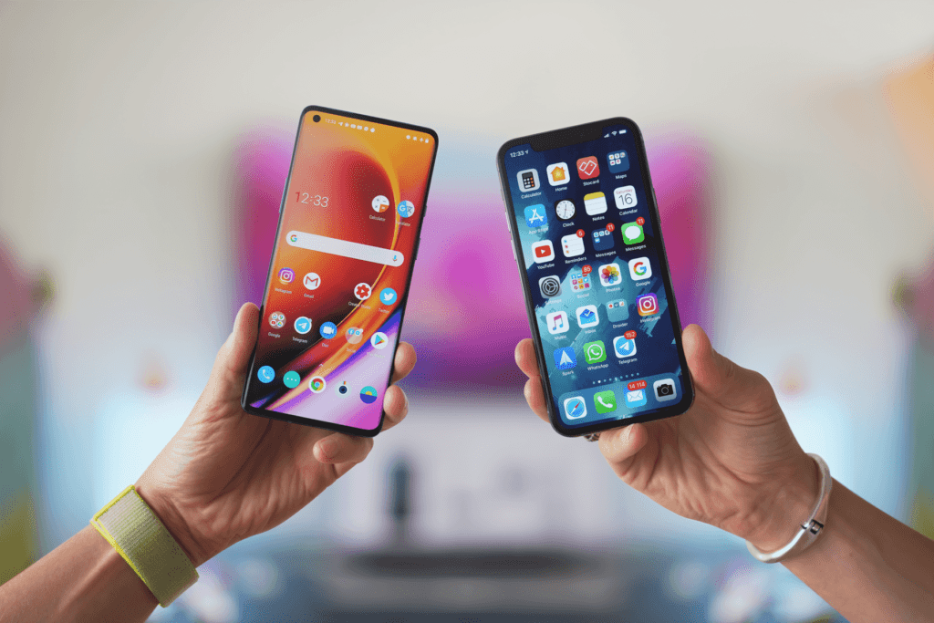 An Android device and iPhone are held side by side to instructions on how to clear all data from your smartphone