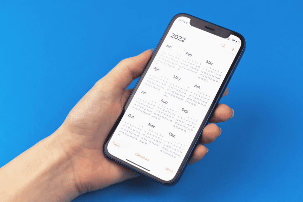 An iPhone is open to the Calendar app to determine if it has the iPhone calendar virus