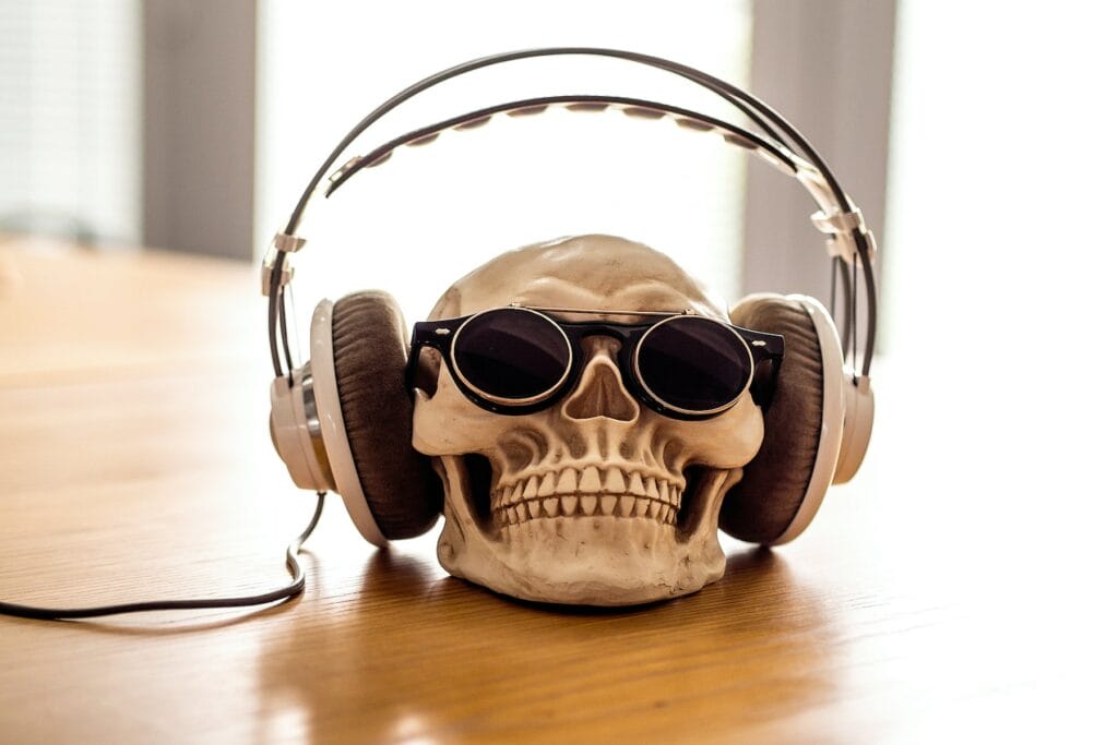 skull listening to headphones