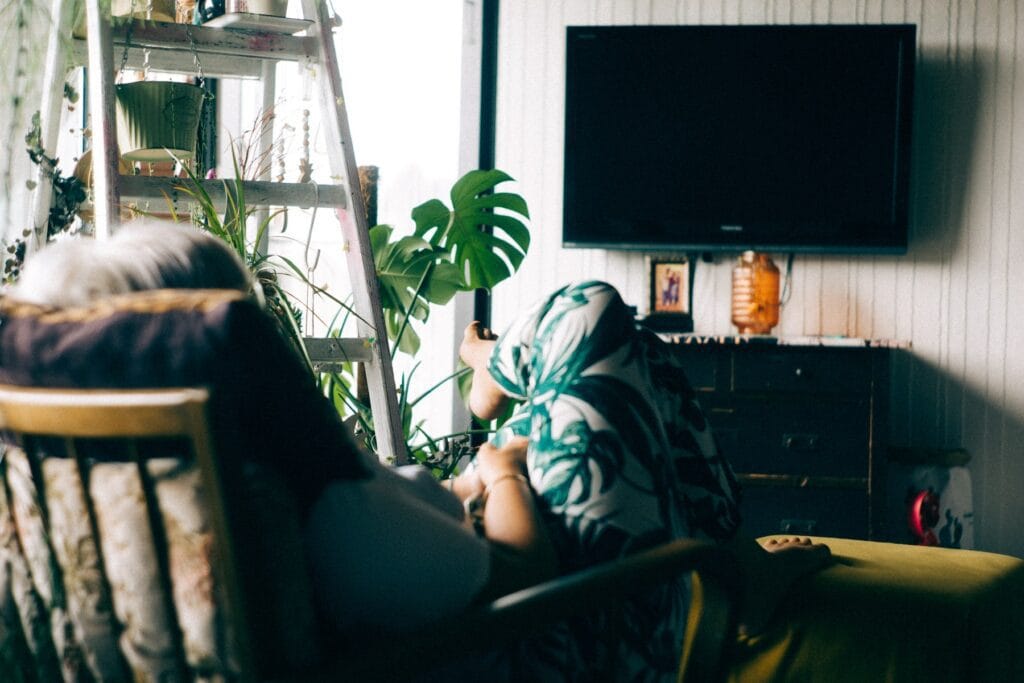 Woman turning on TV