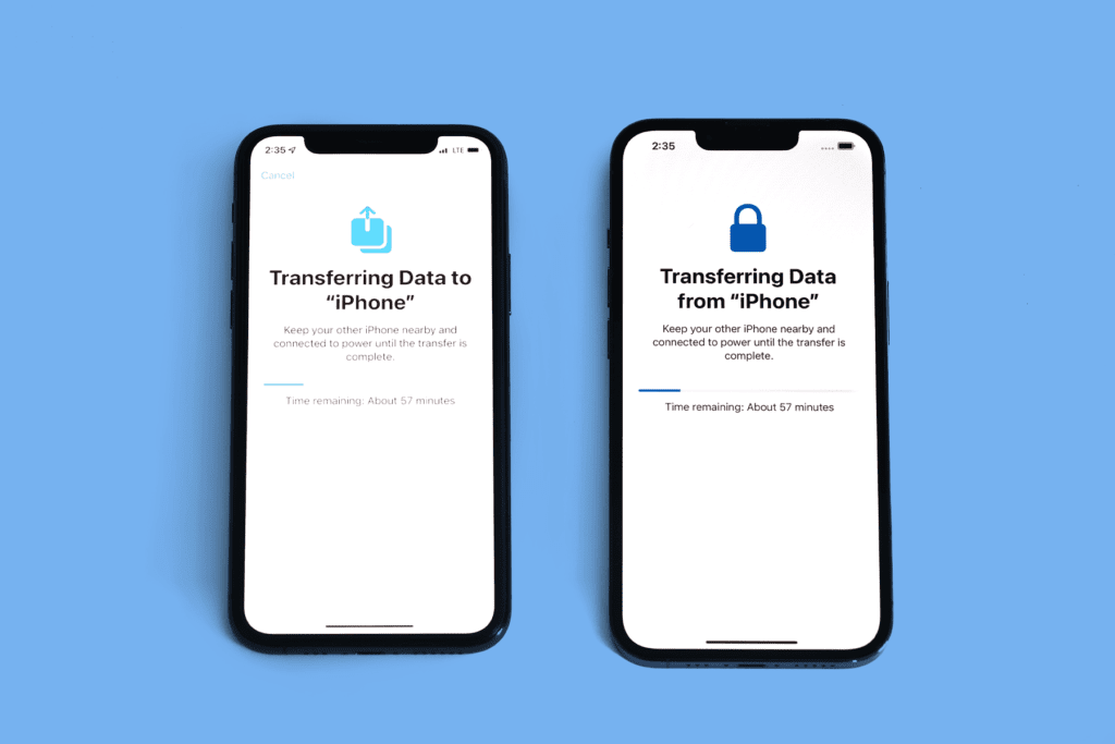 Two iPhones lay side by side; one device transfer iPhone data to the other iPhone