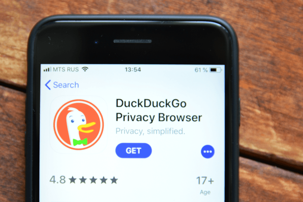 A mobile phone is open to the DuckDuckGo browser installation page. DuckDuckGo received criticism for integrating data tracking in their browser, causing many to wonder Why is DuckDuckGo bad now?