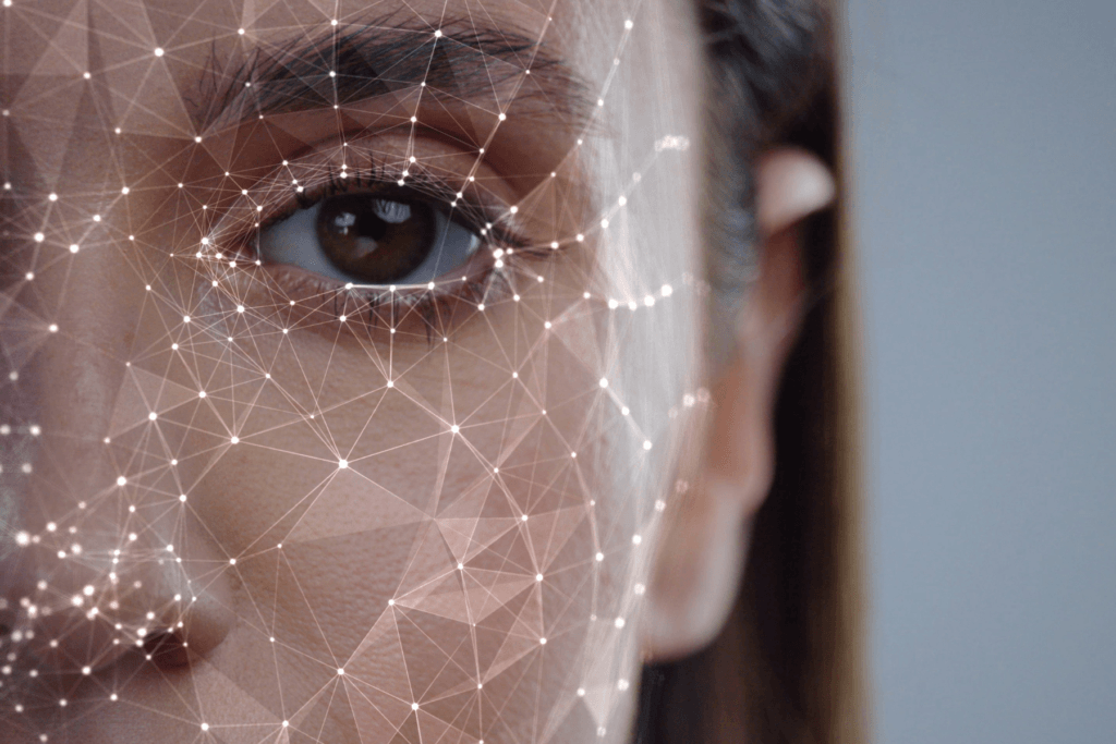 A woman's face being digitally mapped to visualize what AI apps do and ask is Lensa safe.
