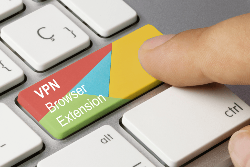 A hand presses a key on a keyboard that said "VPN browser extension" in the same colors as Chrome as though it were a button to start a VPN Google Chrome Extension for the browser