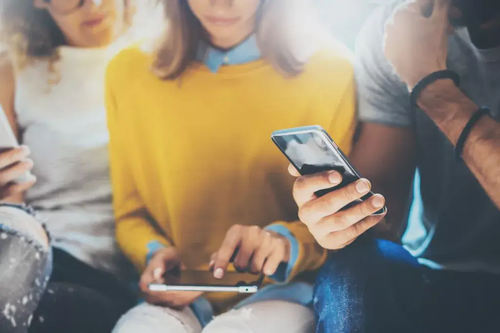Group of friends deleting WhatsApp account