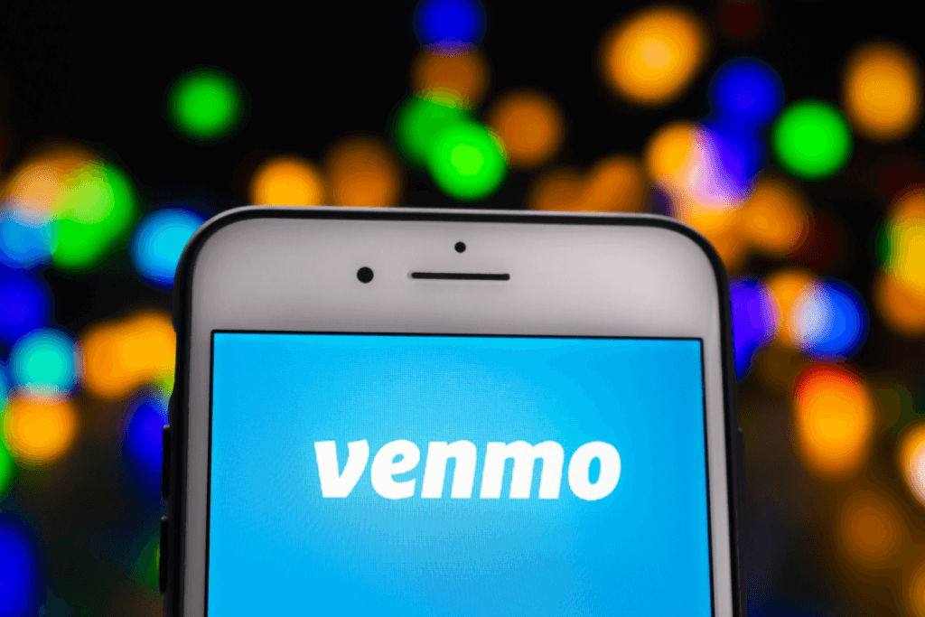 Photograph of a phone displaying Venmo and a colorful background.