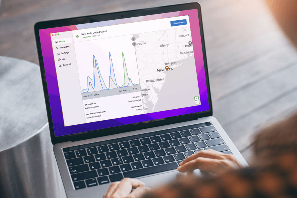 A person uses a Mac laptop computer while running the newSilverBackVPNMac VPN app in Light Mode on the Home screen