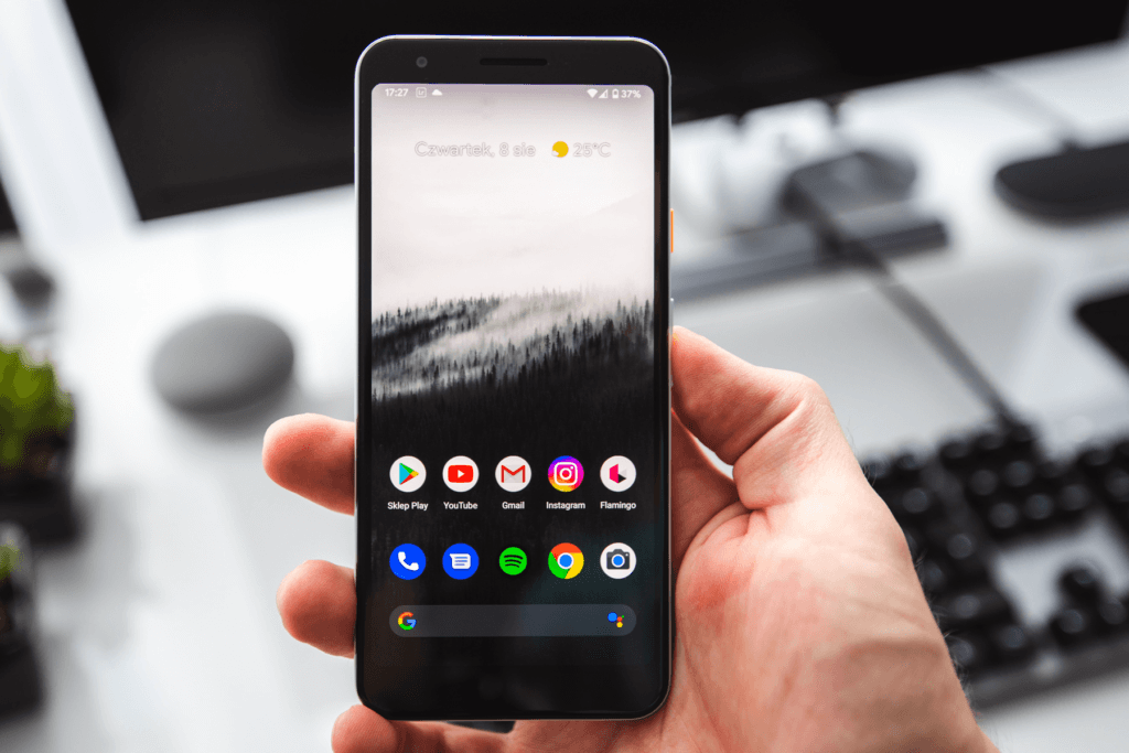 A hand holds an Android phone to depict using free VPNs for Android