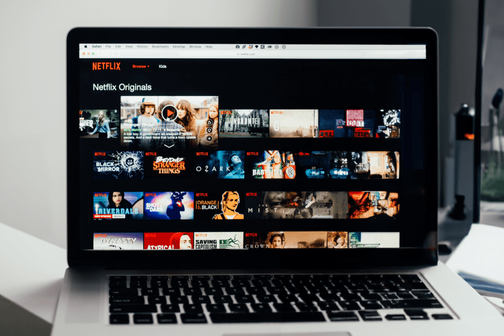 A laptop is open with the Netflix library on the screen as reference to using a free VPN for Netflix