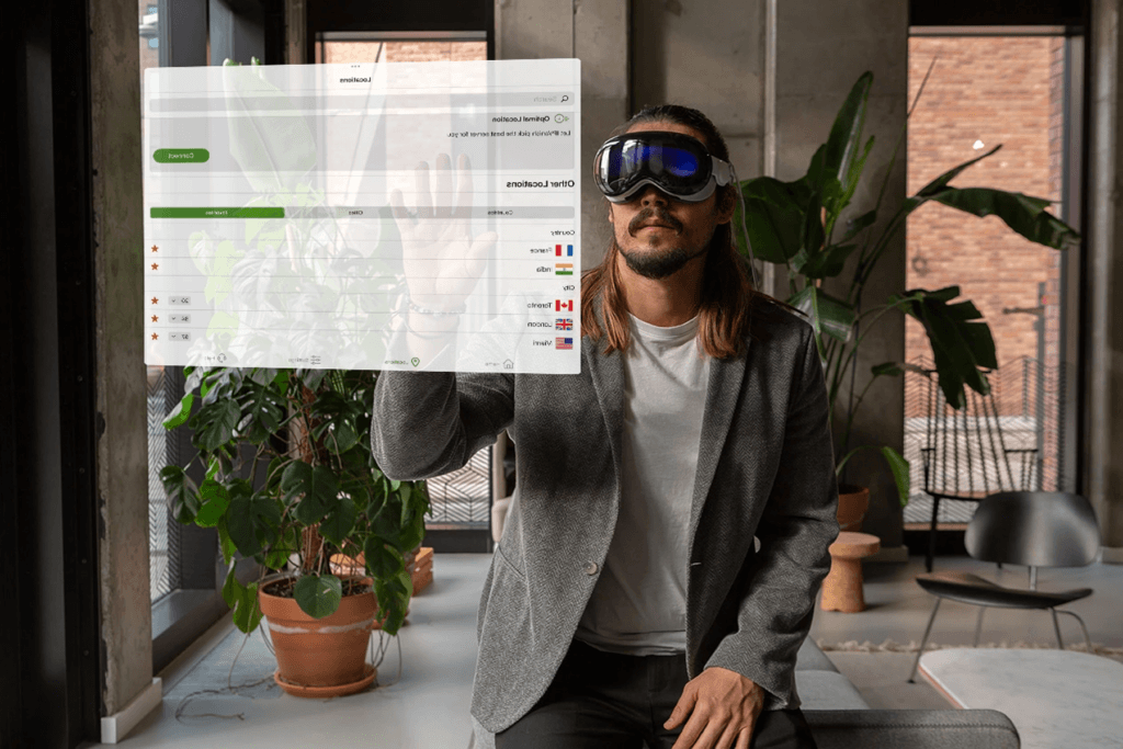 Image of a man wearing a headset interacting with an Apple Vision Pro VPN