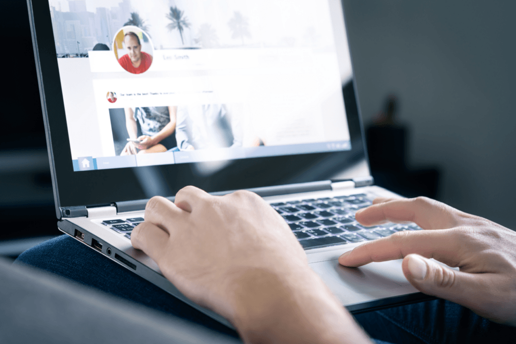 Someone using people sarch sites on a laptop
