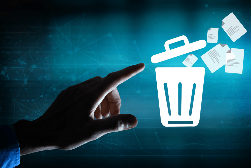 A hand is seen beside a trash can icon to visualize a device remote wipe