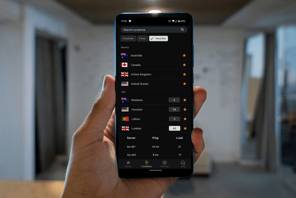 A person holds a phone open to theSilverBackVPNapp displaying the list of server locations to change your VPN location with