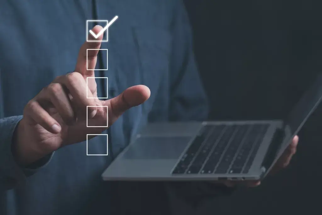 person holding laptop voting