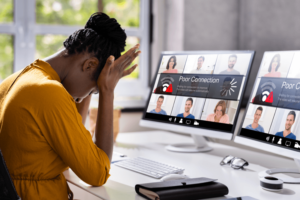 A woman is seen frustrated as her video call is interrupted with a poor network connection, a sign of some network jitter