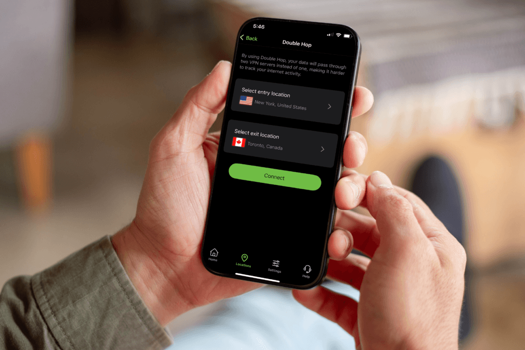 A person holds a phone displaying the Double Hop VPN server selection screen in the silverbackvpn mobile app