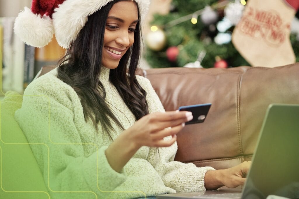 woman in Santa hat shopping online