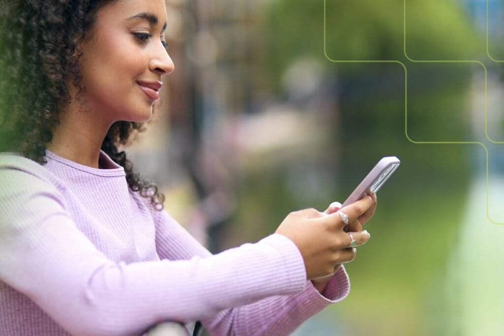 woman using mobile phone outdoors