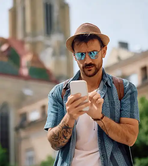 Man traveling looking at phone