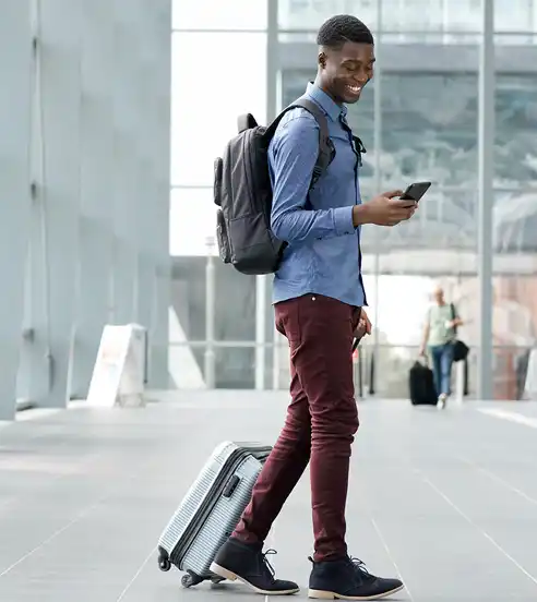 Man Traveling looking at phone