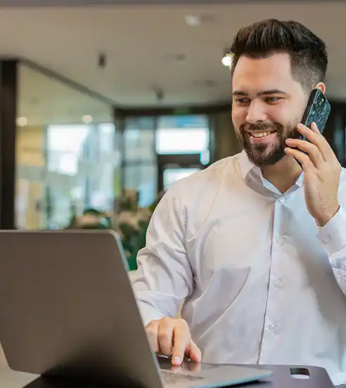 Man using laptop in lobby