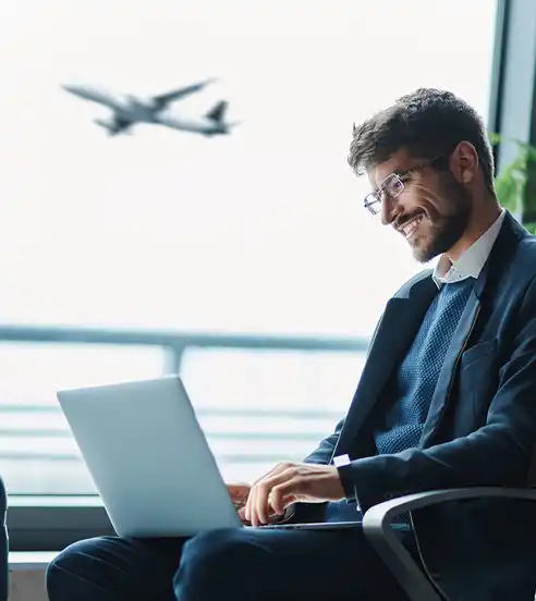Man travelling working on laptop