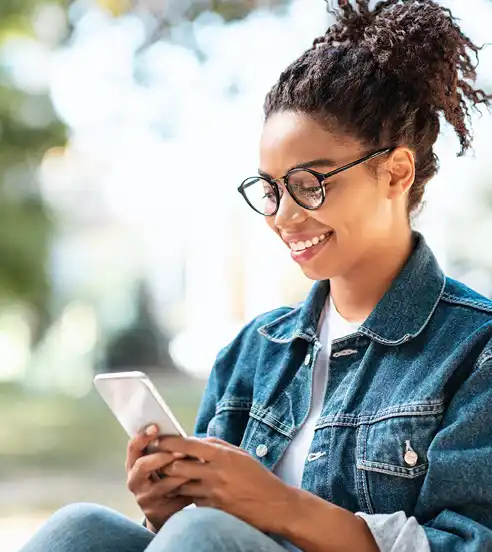 Woman looking at phone at park